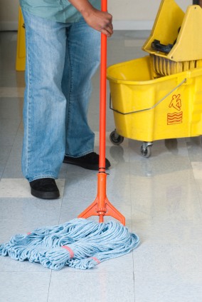 GCS Global Cleaning Services LLC janitor in Dudleyville, AZ mopping floor.